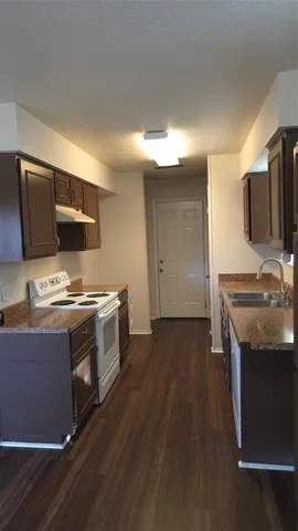 a kitchen with stainless steel appliances granite countertop a stove and a sink