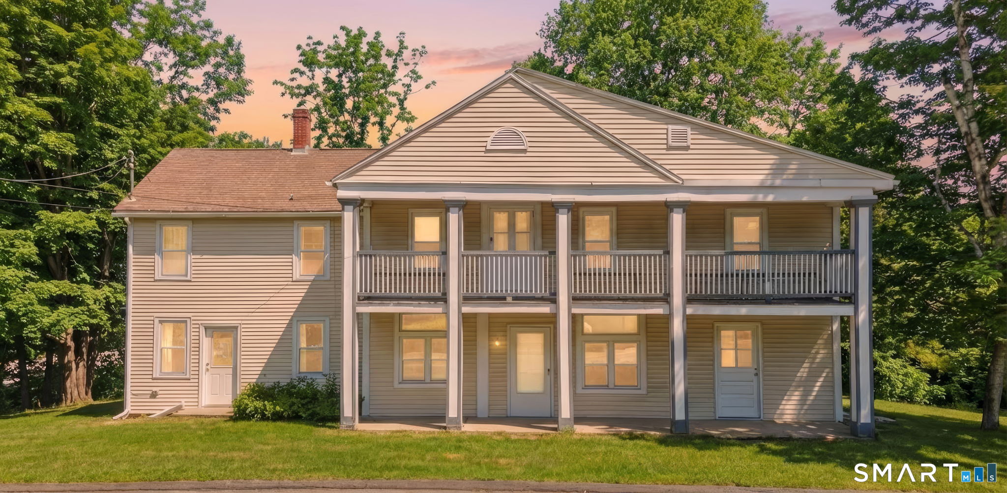 a front view of a house with a yard