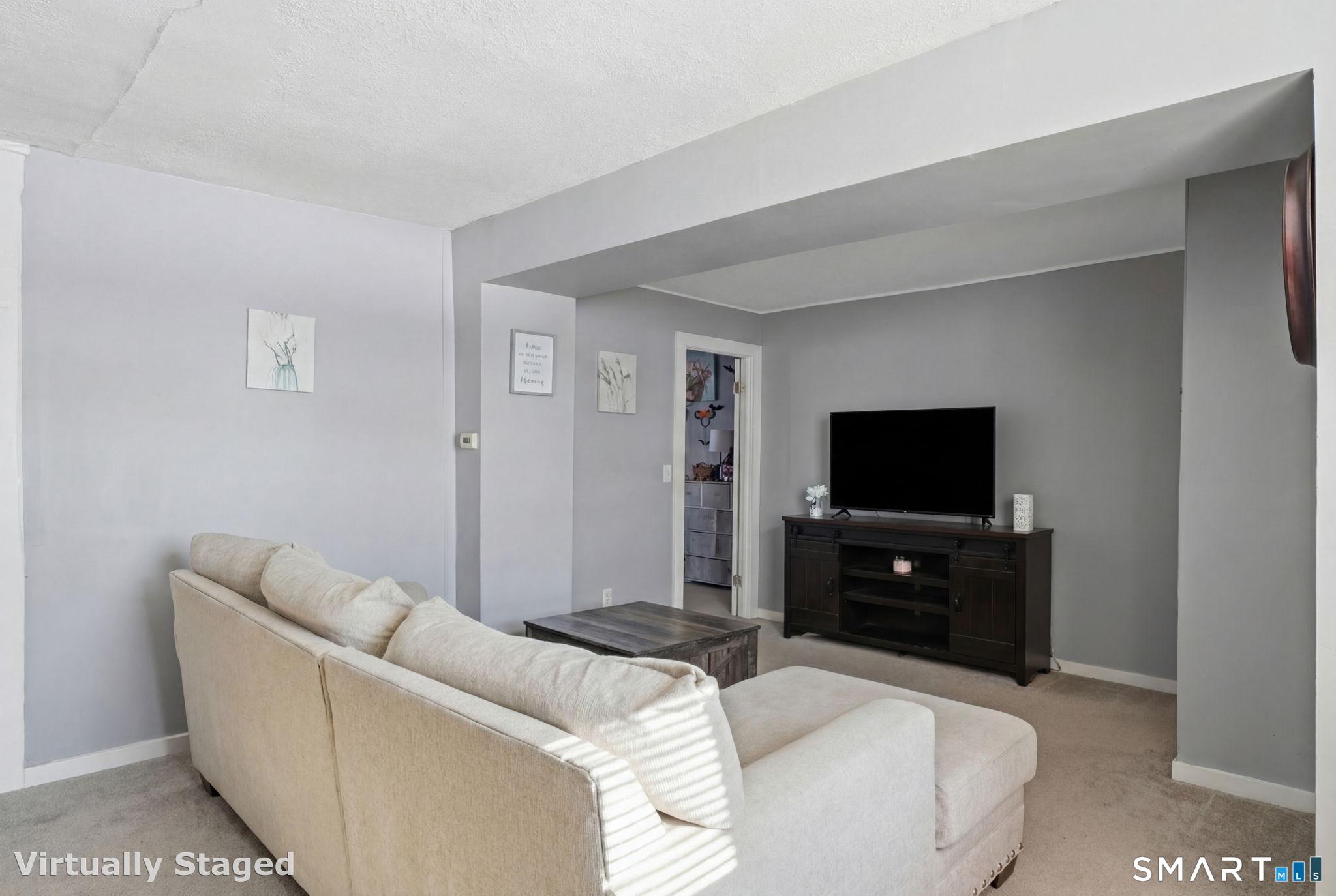 380 North Granby Road Granby, CT 06060 - Photo 16 of 39 a living room with furniture and a flat screen tv