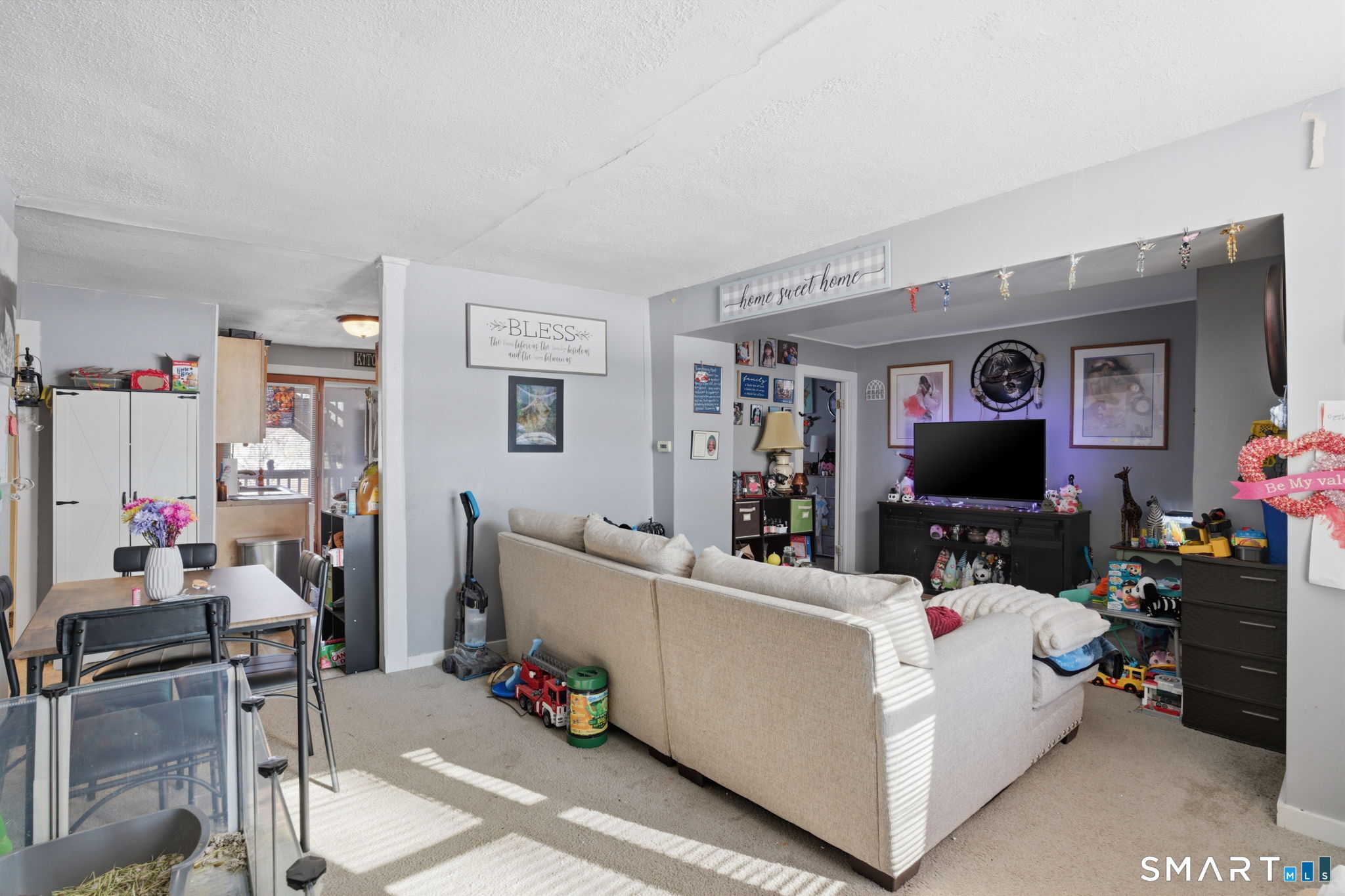 380 North Granby Road Granby, CT 06060 - Photo 17 of 39 a living room with furniture and a flat screen tv