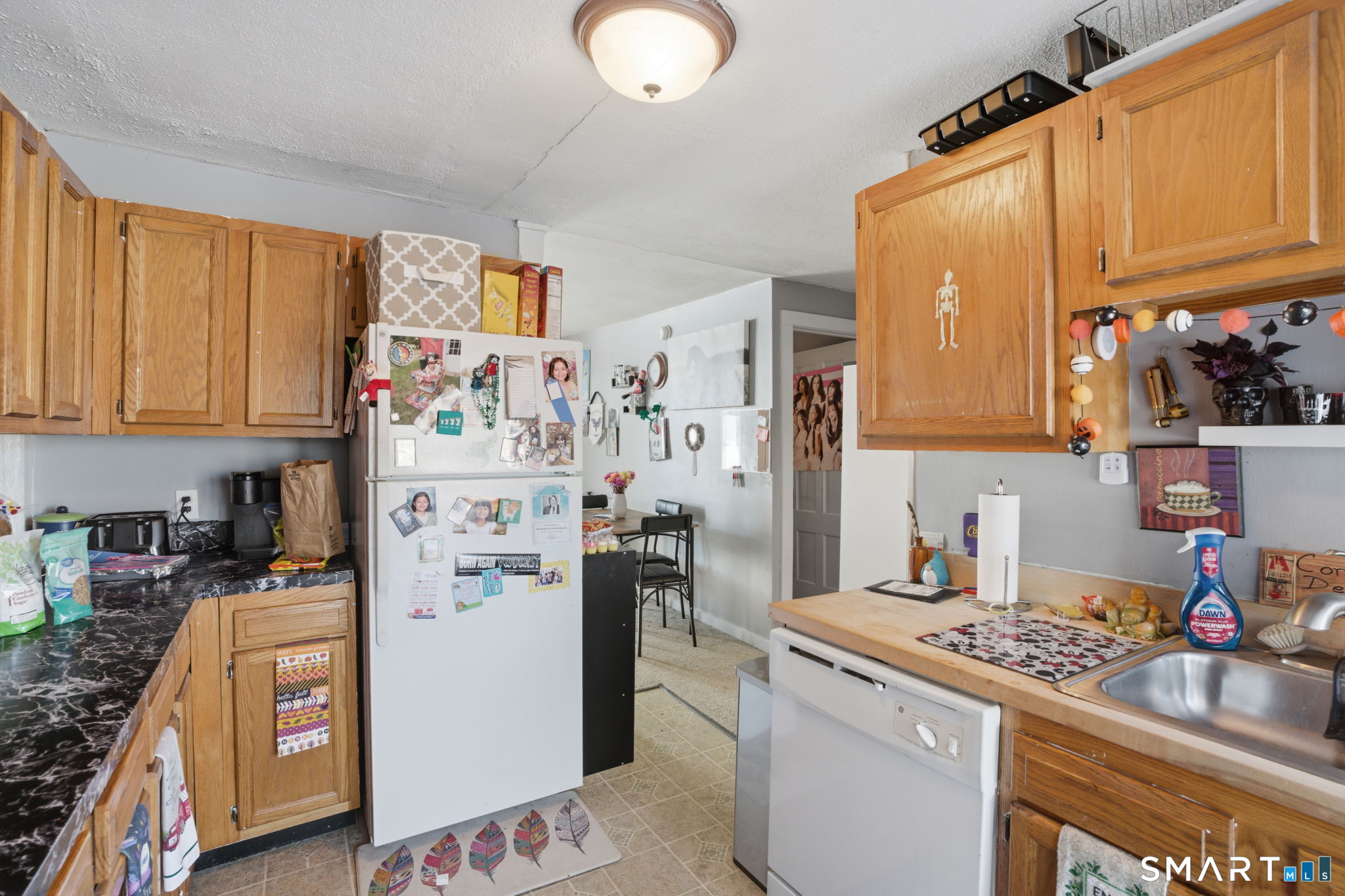 380 North Granby Road Granby, CT 06060 - Photo 18 of 39 a kitchen with stainless steel appliances granite countertop a refrigerator a stove top oven a sink and dishwasher