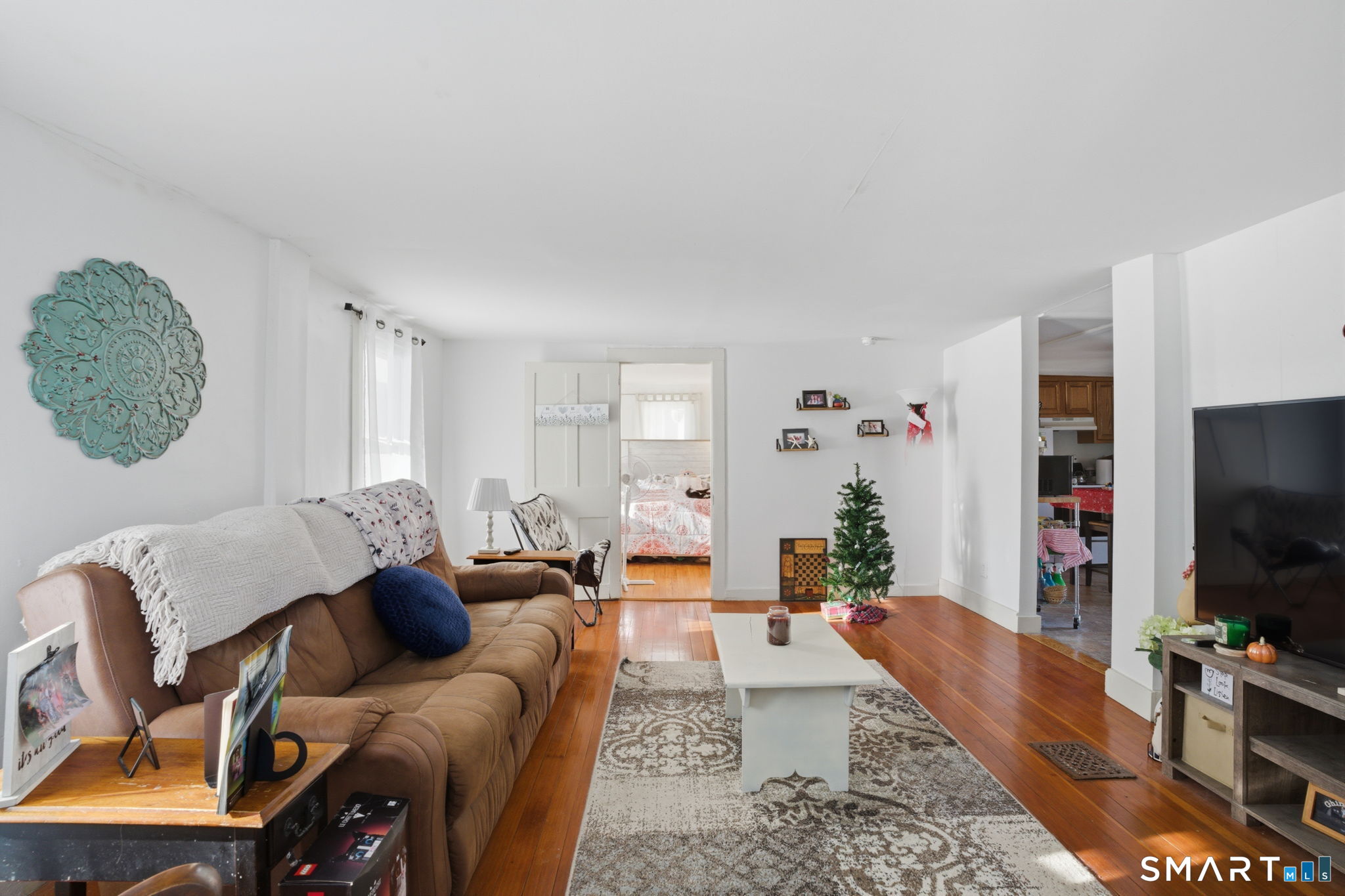 380 North Granby Road Granby, CT 06060 - Photo 24 of 39 a living room with furniture and a flat screen tv