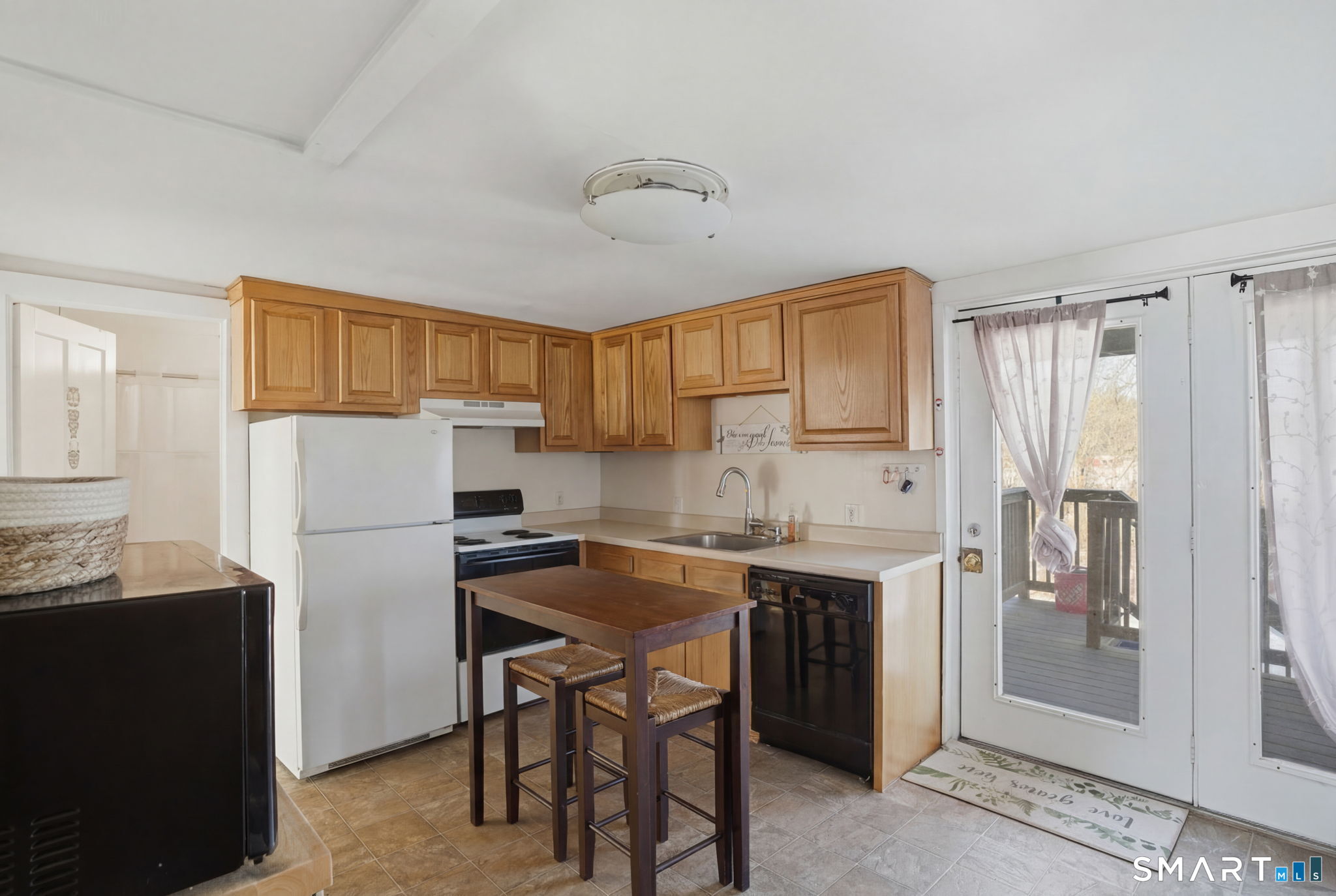 380 North Granby Road Granby, CT 06060 - Photo 25 of 39 a kitchen with a refrigerator a sink and cabinets