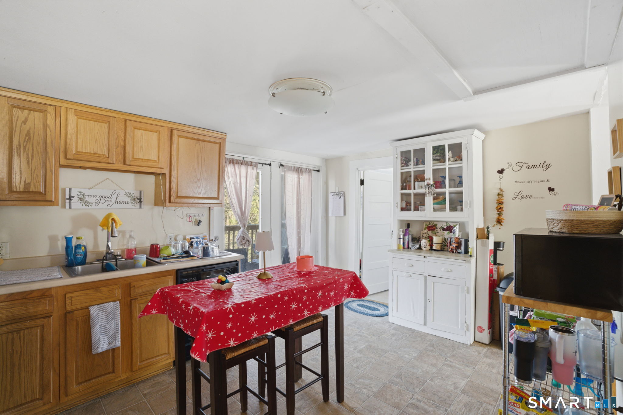 380 North Granby Road Granby, CT 06060 - Photo 26 of 39 a kitchen with stainless steel appliances a stove a refrigerator a sink dishwasher a dining table and chairs with wooden floor