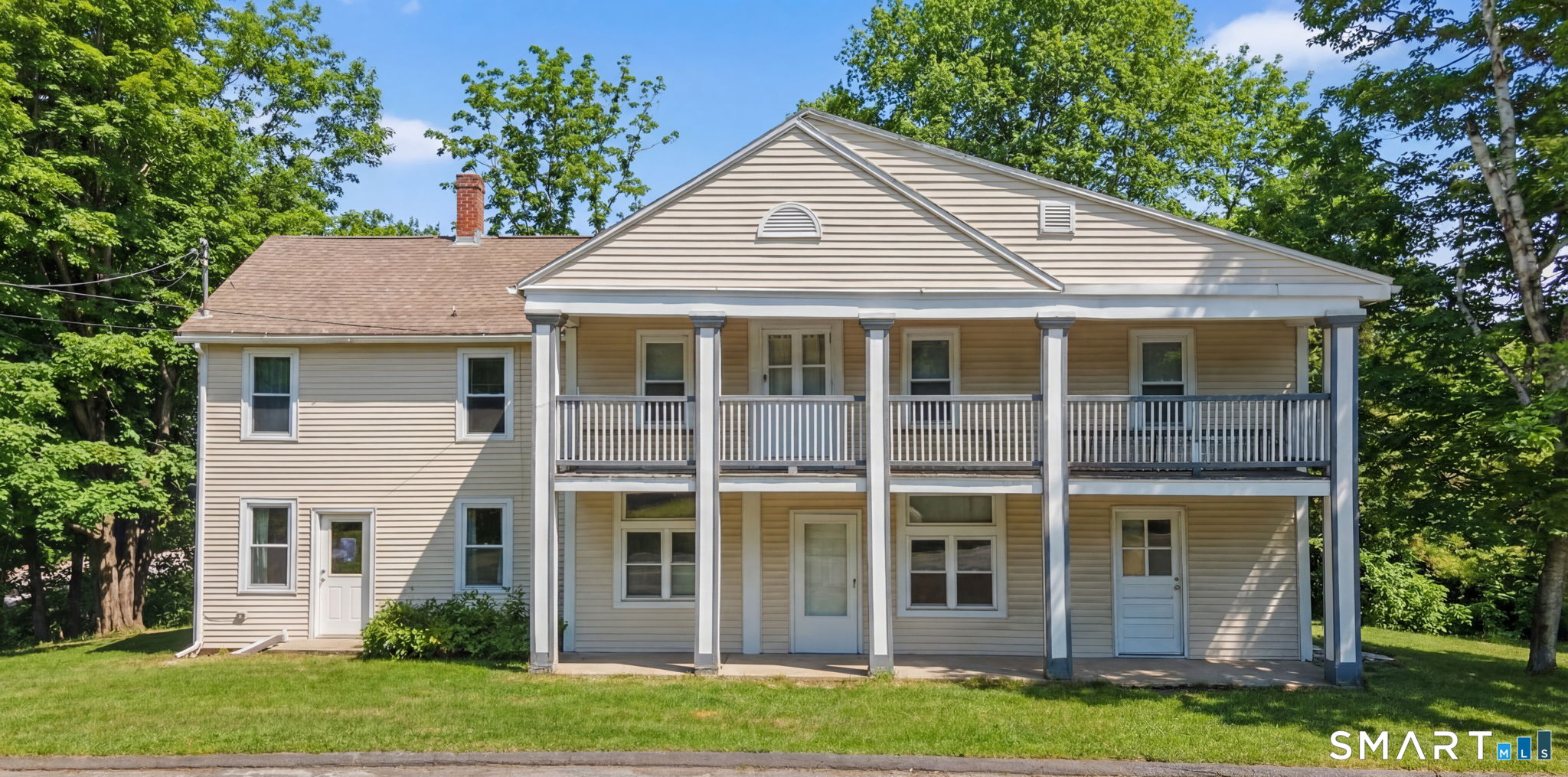 380 North Granby Road Granby, CT 06060 - Photo 30 of 39 a view of a white house with windows and garden
