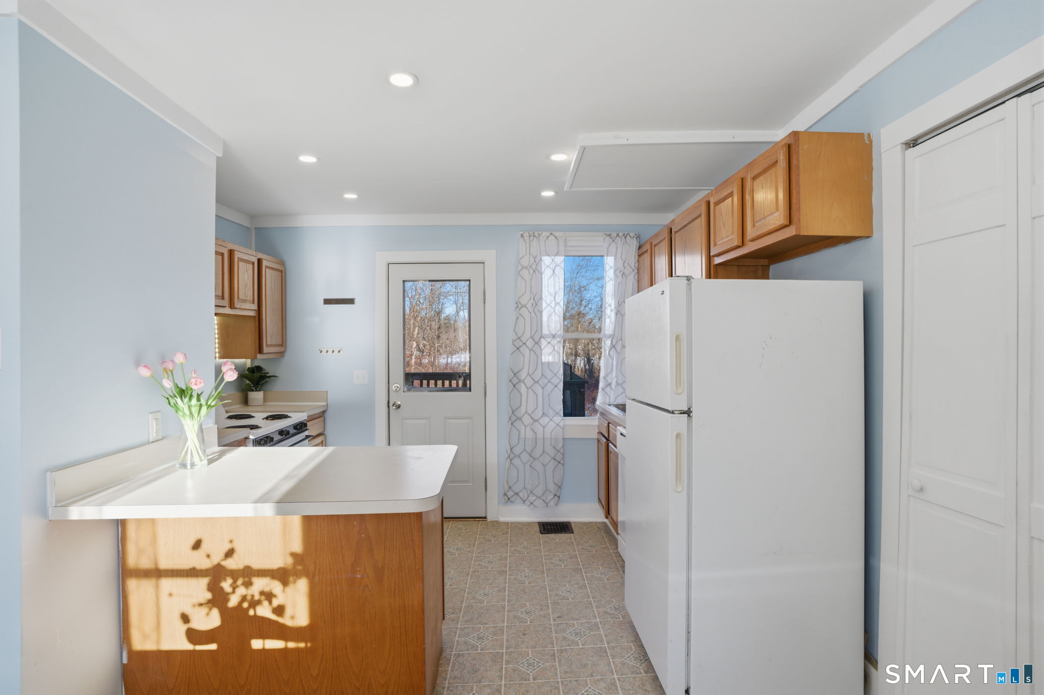380 North Granby Road Granby, CT 06060 - Photo 8 of 39 a kitchen with a refrigerator a sink and a refrigerator