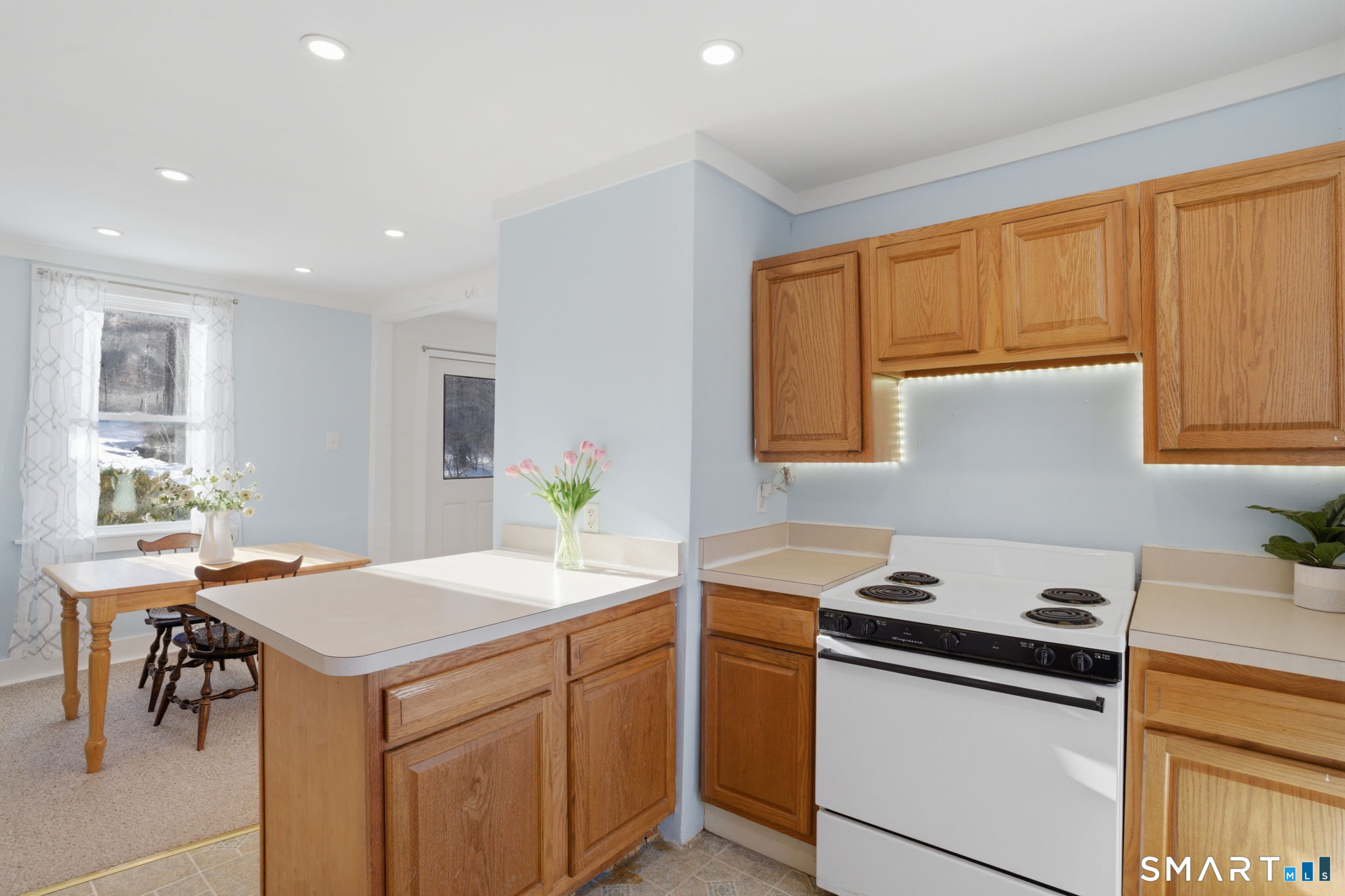 380 North Granby Road Granby, CT 06060 - Photo 9 of 39 a kitchen that has a sink a stove counter top space and cabinets