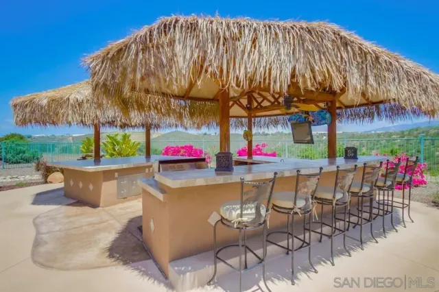 a patio with table and chairs