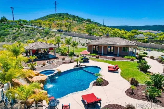 a view of swimming pool with outdoor seating