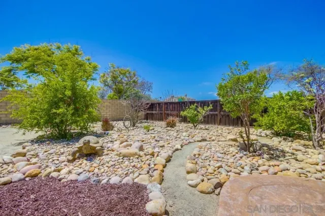 a view of a garden with a pathway