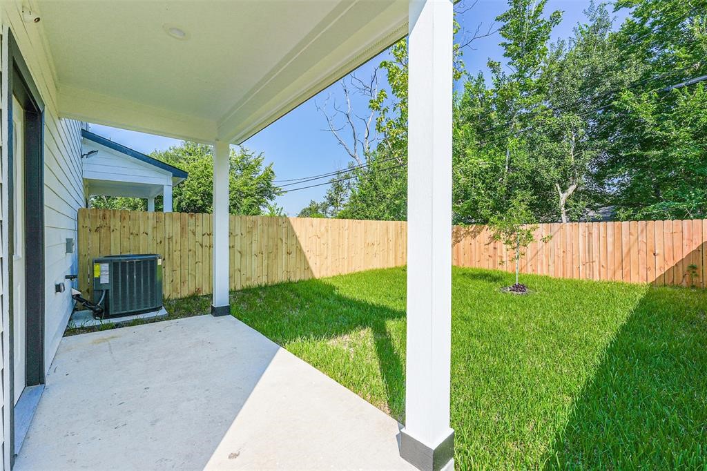 5317 Chennault Road, Unit A Houston, TX 77033 - Photo 11 of 11 a view of a back yard from a room