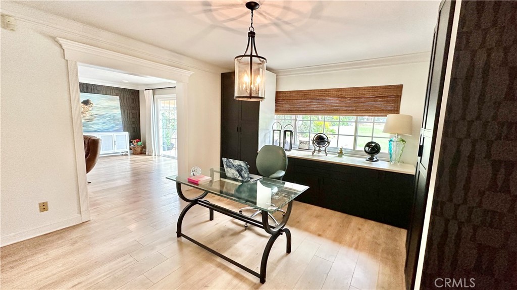 19559 Tulsa Street Porter Ranch, CA 91326 - Photo 14 of 55 a dining room with table chairs and a chandelier