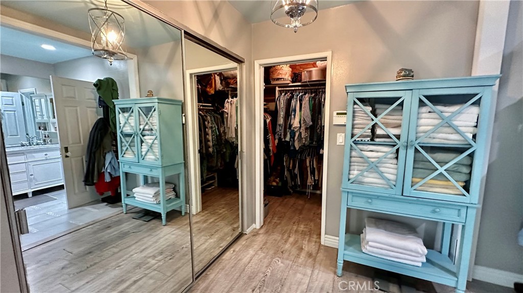 19559 Tulsa Street Porter Ranch, CA 91326 - Photo 25 of 55 a view of a hallway with wooden floor and windows