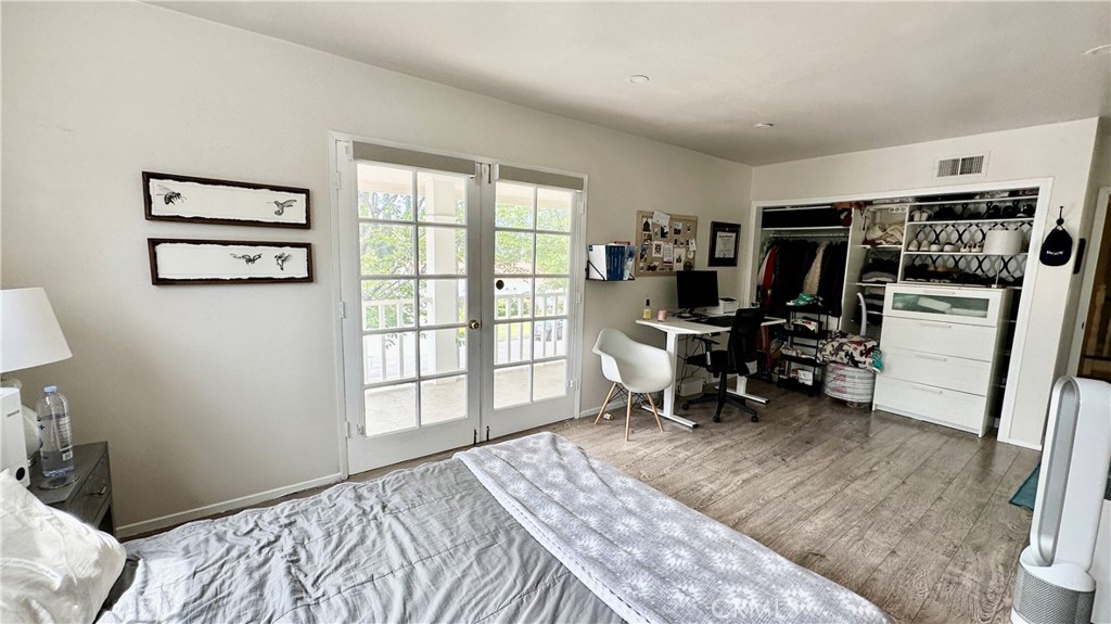 19559 Tulsa Street Porter Ranch, CA 91326 - Photo 33 of 55 a bedroom with furniture and a window