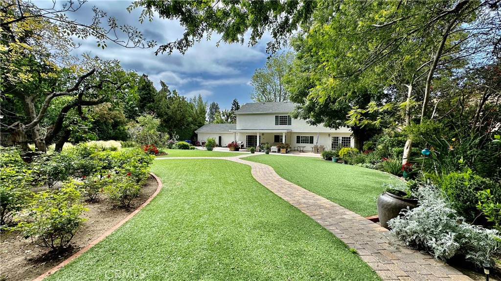 19559 Tulsa Street Porter Ranch, CA 91326 - Photo 34 of 55 a view of house with a big yard and large trees