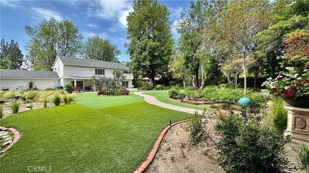 19559 Tulsa Street Porter Ranch, CA 91326 - Photo 35 of 55 a view of a house with a yard
