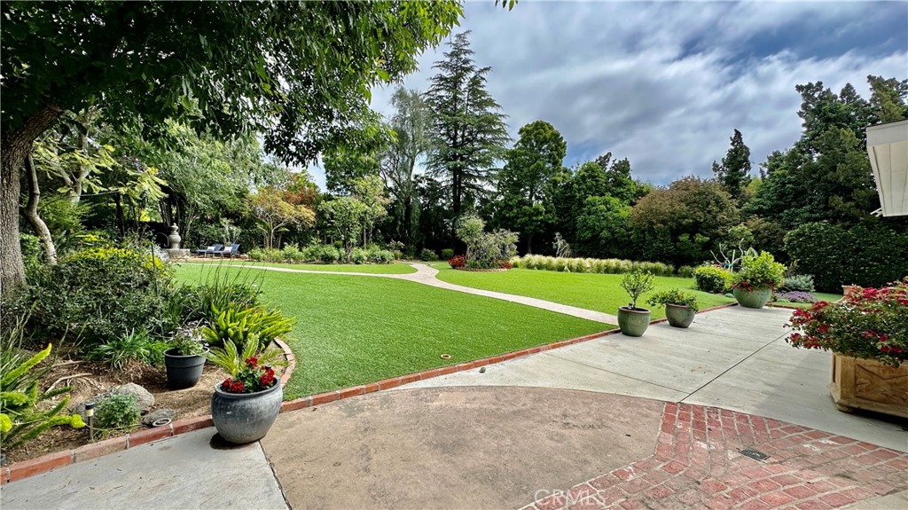 19559 Tulsa Street Porter Ranch, CA 91326 - Photo 38 of 55 a view of a garden with a trampoline