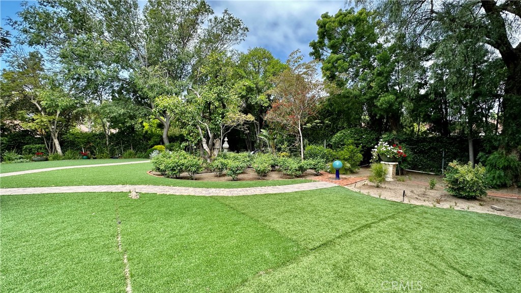 19559 Tulsa Street Porter Ranch, CA 91326 - Photo 53 of 55 a view of a backyard with a garden