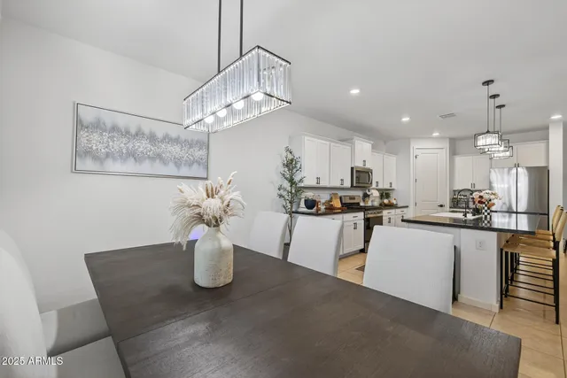 a kitchen with a white cabinets and appliances