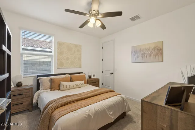 a bedroom with a bed and a couch