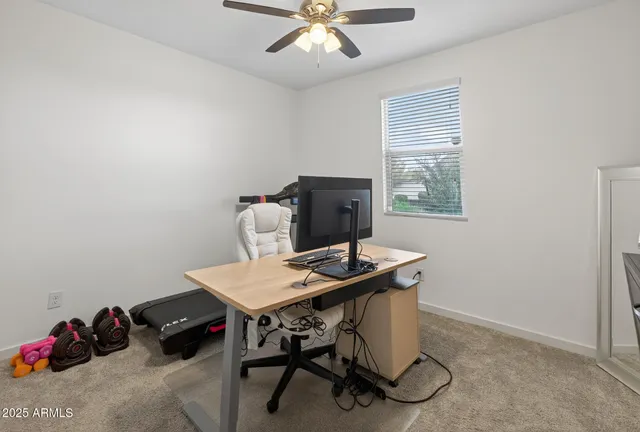 a workspace with furniture and window