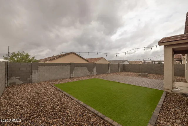 an aerial view of a residential houses with outdoor space