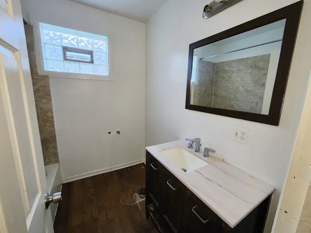 a bathroom with a sink and a mirror