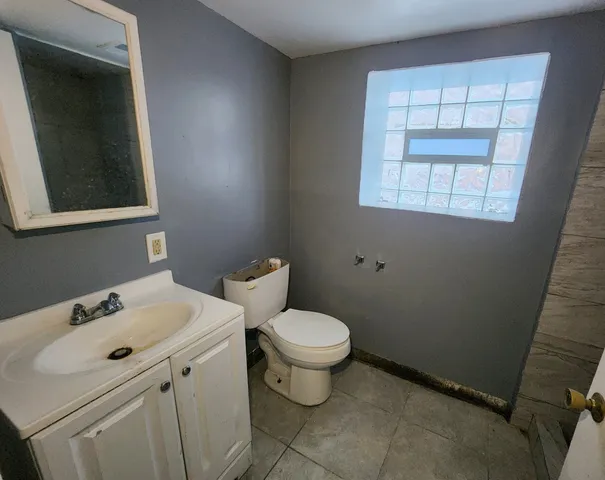 a bathroom with a sink and a toilet