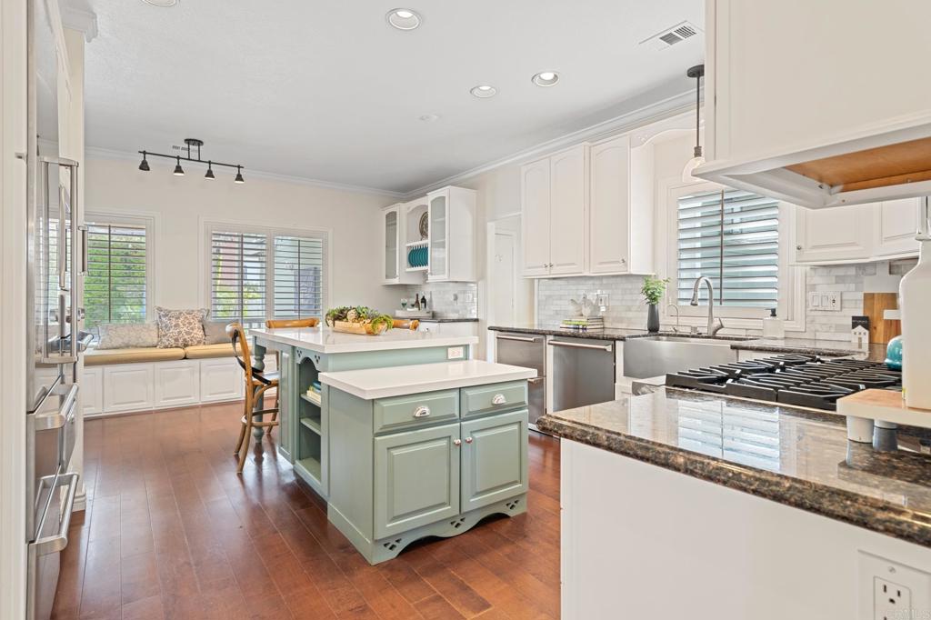 14403 Gaslight Court Poway, CA 92064 - Photo 17 of 58 a kitchen with a stove a sink and a refrigerator