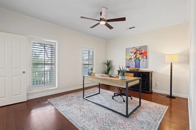 a view of an empty room with stairs and a window