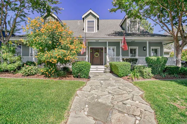 front view of a house with a garden