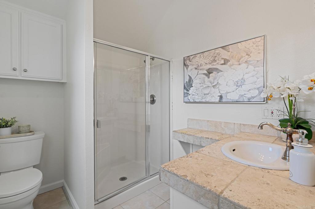 14403 Gaslight Court Poway, CA 92064 - Photo 33 of 58 a bathroom with a sink a toilet and shower