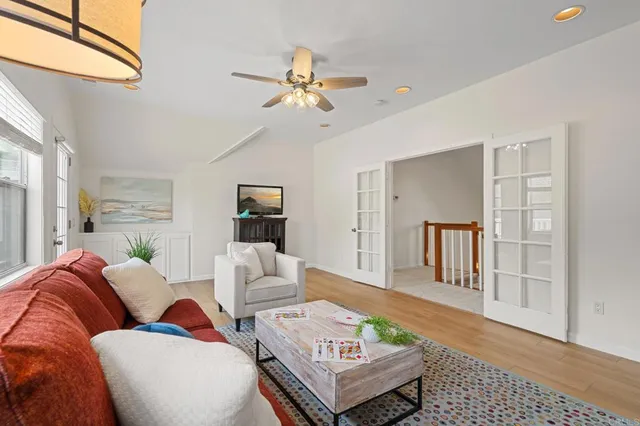 a view of a house with pool and sitting area