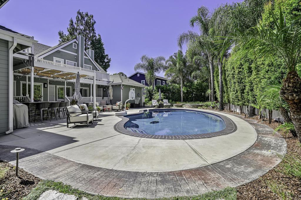 14403 Gaslight Court Poway, CA 92064 - Photo 42 of 58 a view of a house with pool and sitting area
