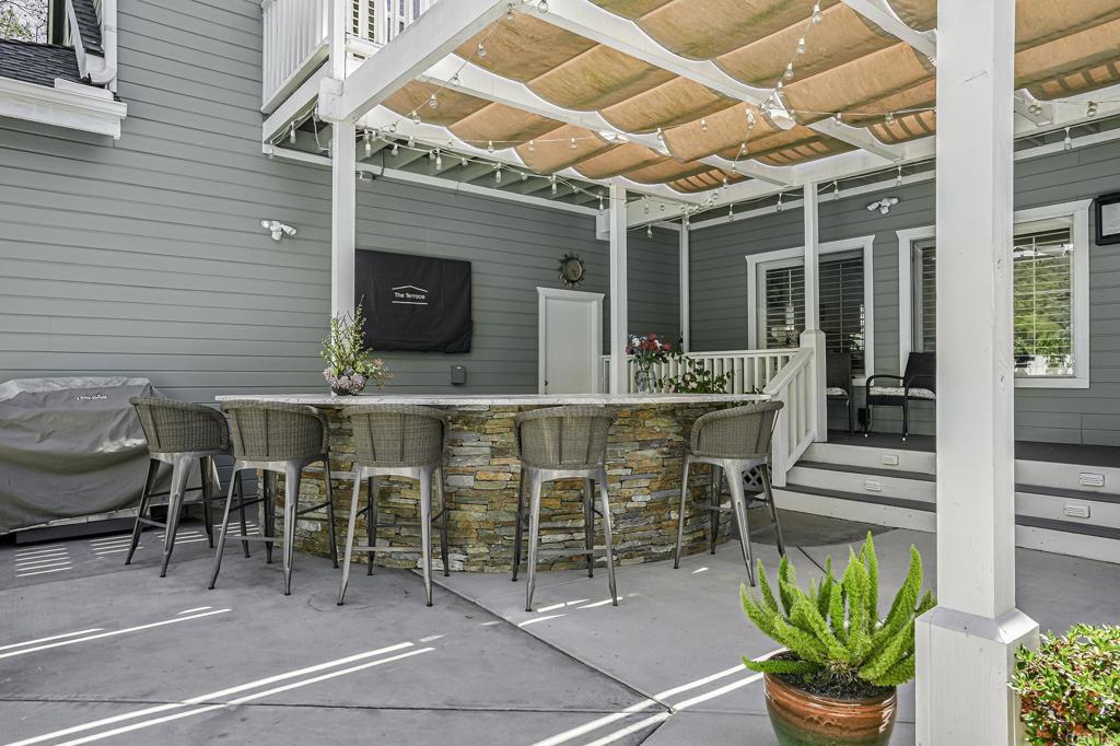 14403 Gaslight Court Poway, CA 92064 - Photo 43 of 58 a view of a patio with a table and chairs