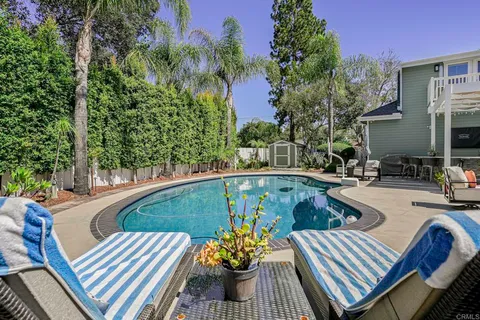 a front view of a building with sitting area