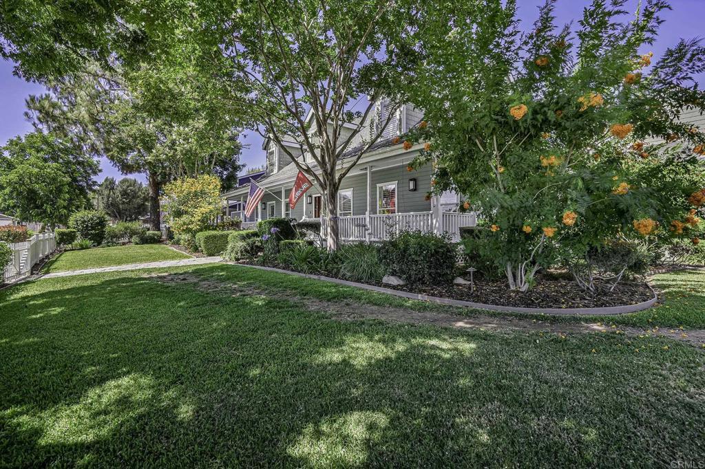 14403 Gaslight Court Poway, CA 92064 - Photo 5 of 58 a front view of a house with garden
