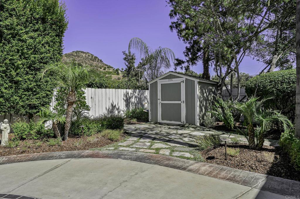 14403 Gaslight Court Poway, CA 92064 - Photo 52 of 58 a front view of a house with a yard and garage