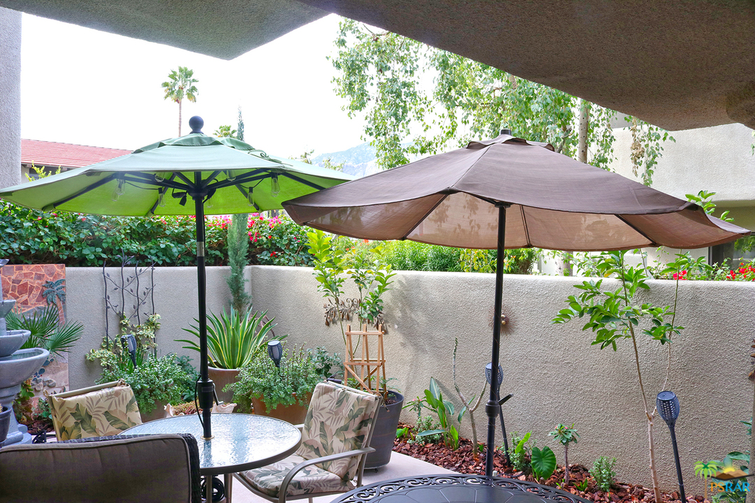 a garden view with a seating space