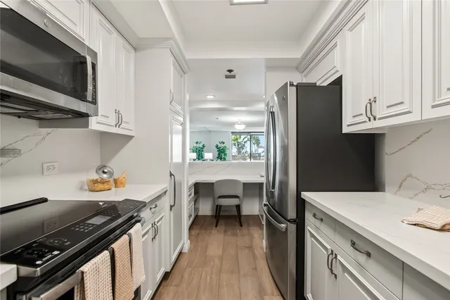 a kitchen with a sink stove and refrigerator