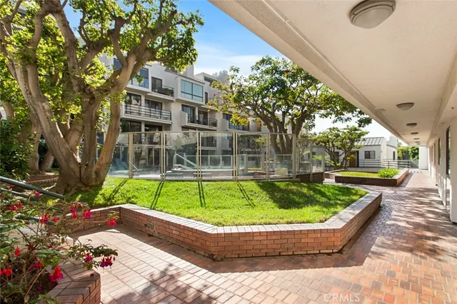 a view of a swimming pool with a patio