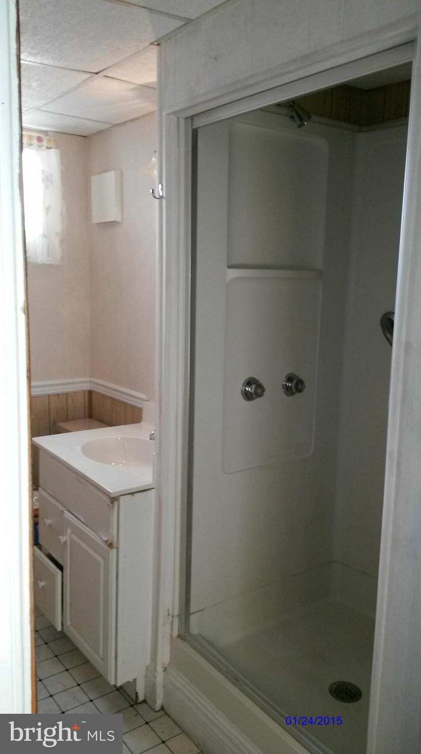 10213 Rodgers Road Fairfax, VA 22030 - Photo 17 of 26 a bathroom with a granite countertop sink and vanity