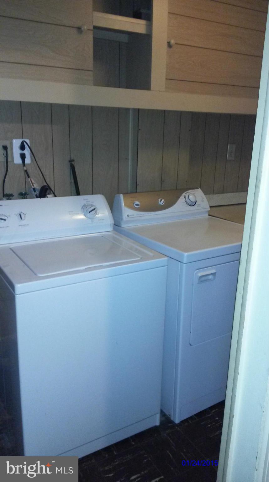 10213 Rodgers Road Fairfax, VA 22030 - Photo 21 of 26 a bathroom with a sink and cabinets