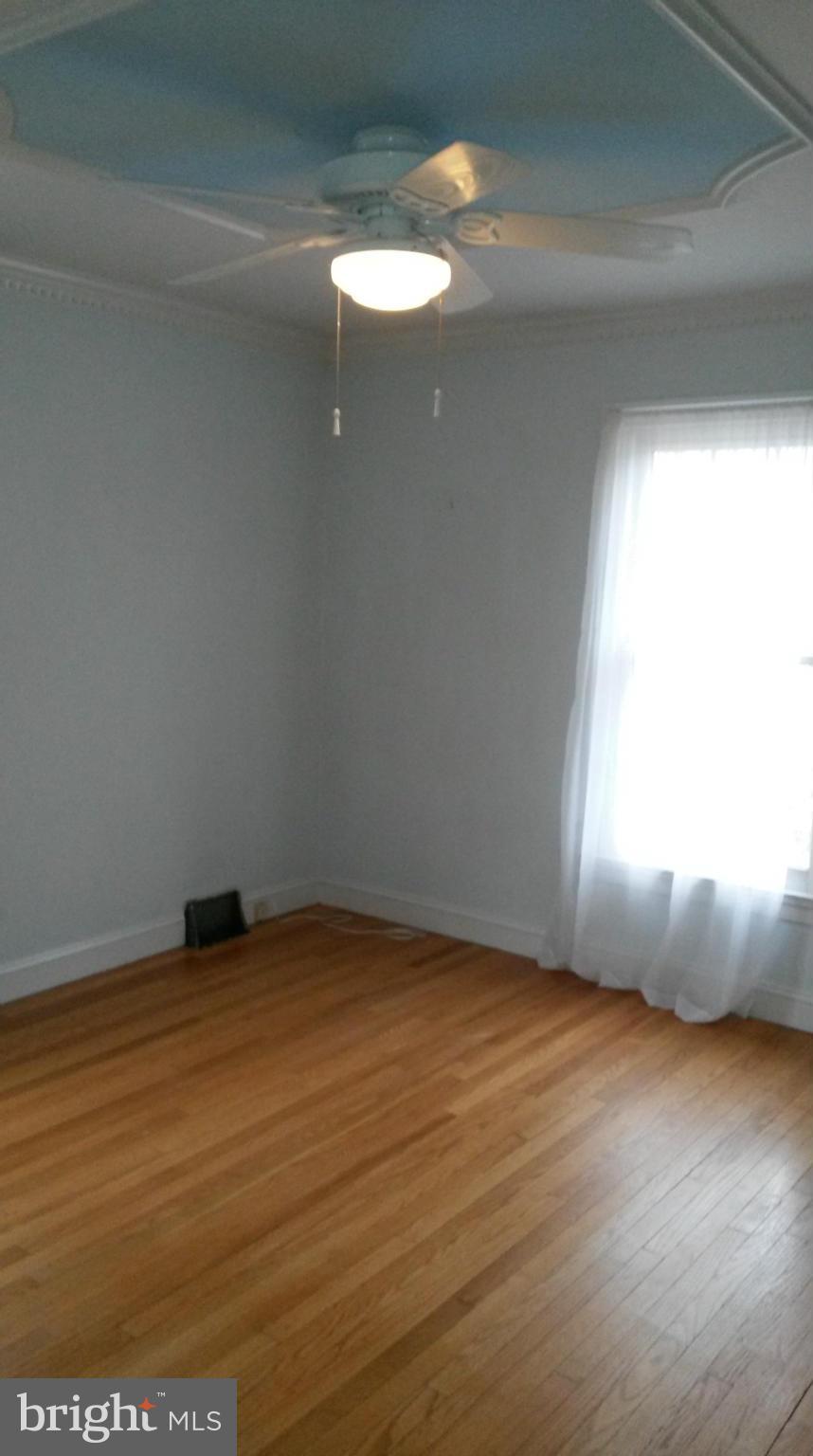 10213 Rodgers Road Fairfax, VA 22030 - Photo 9 of 26 a view of an empty room and window