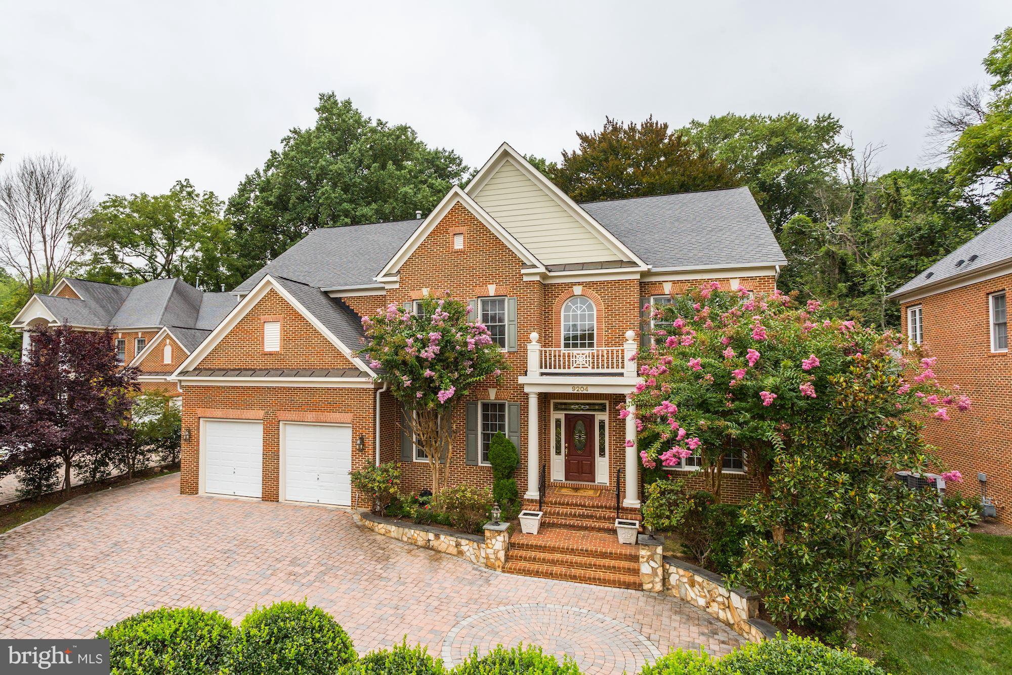 9204 Jones Mill Road Chevy Chase, MD 20815 - Photo 1 of 50 a front view of a house with a yard