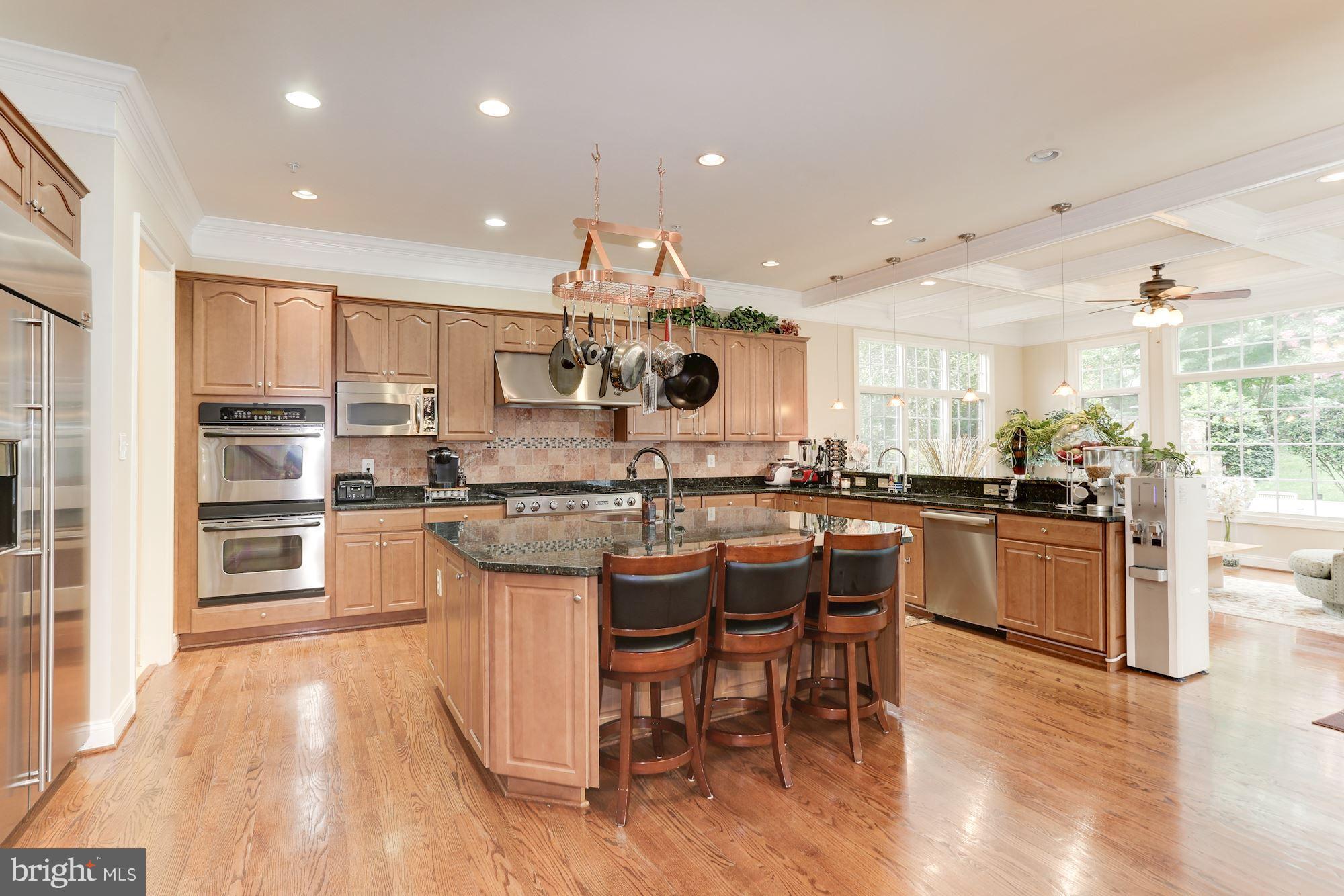 9204 Jones Mill Road Chevy Chase, MD 20815 - Photo 14 of 50 a kitchen with a sink cabinets and wooden floor