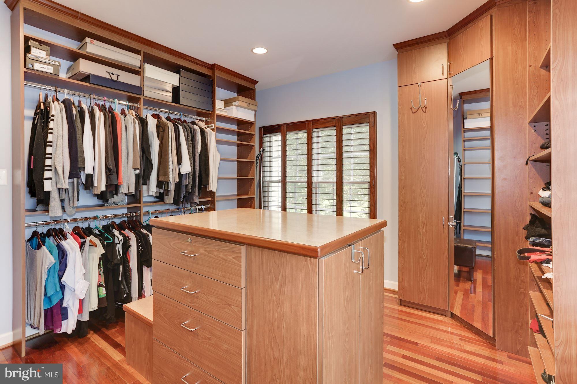 9204 Jones Mill Road Chevy Chase, MD 20815 - Photo 22 of 50 a view of a walk in closet with clothes and shoes
