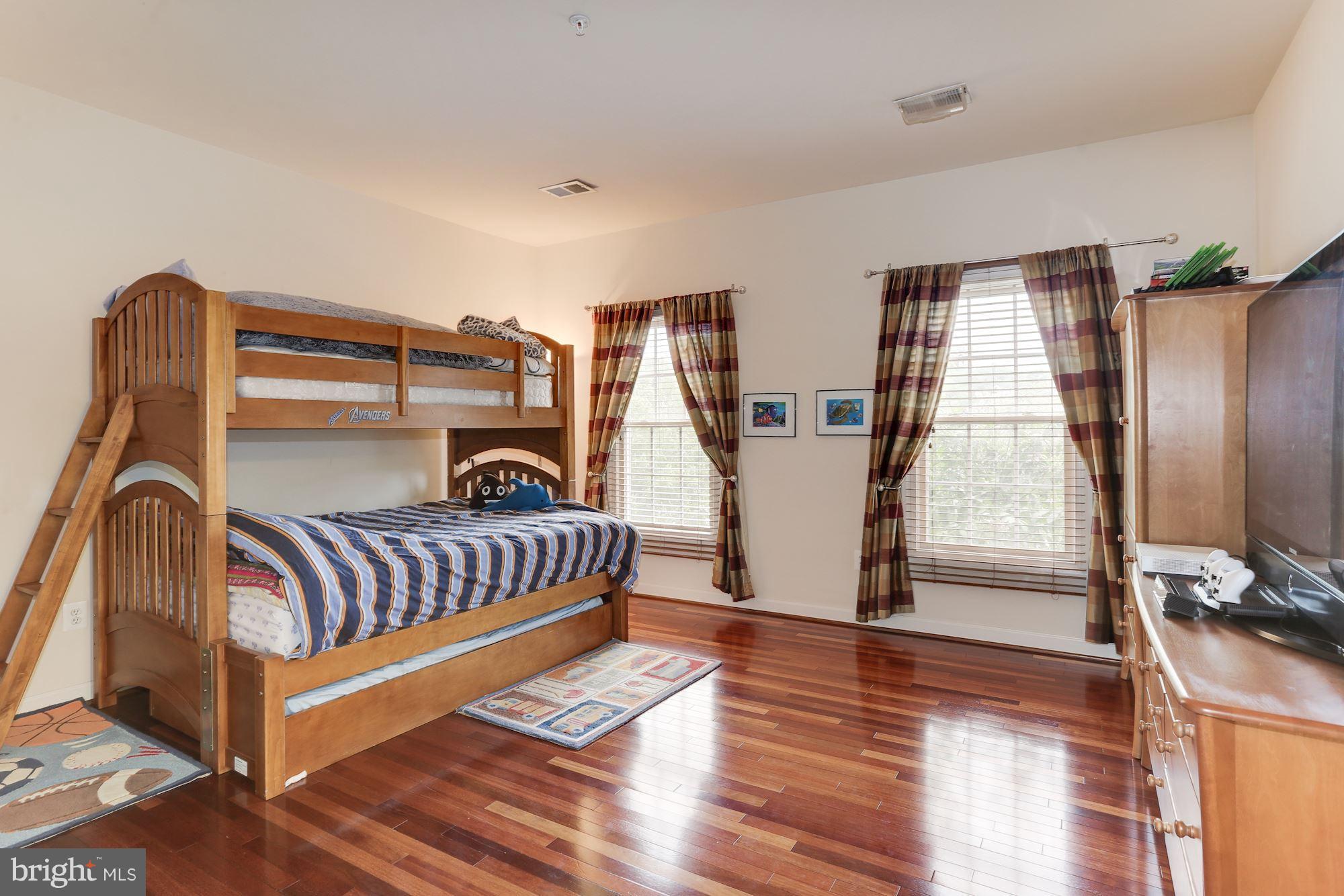 9204 Jones Mill Road Chevy Chase, MD 20815 - Photo 29 of 50 a bedroom with furniture and wooden floor