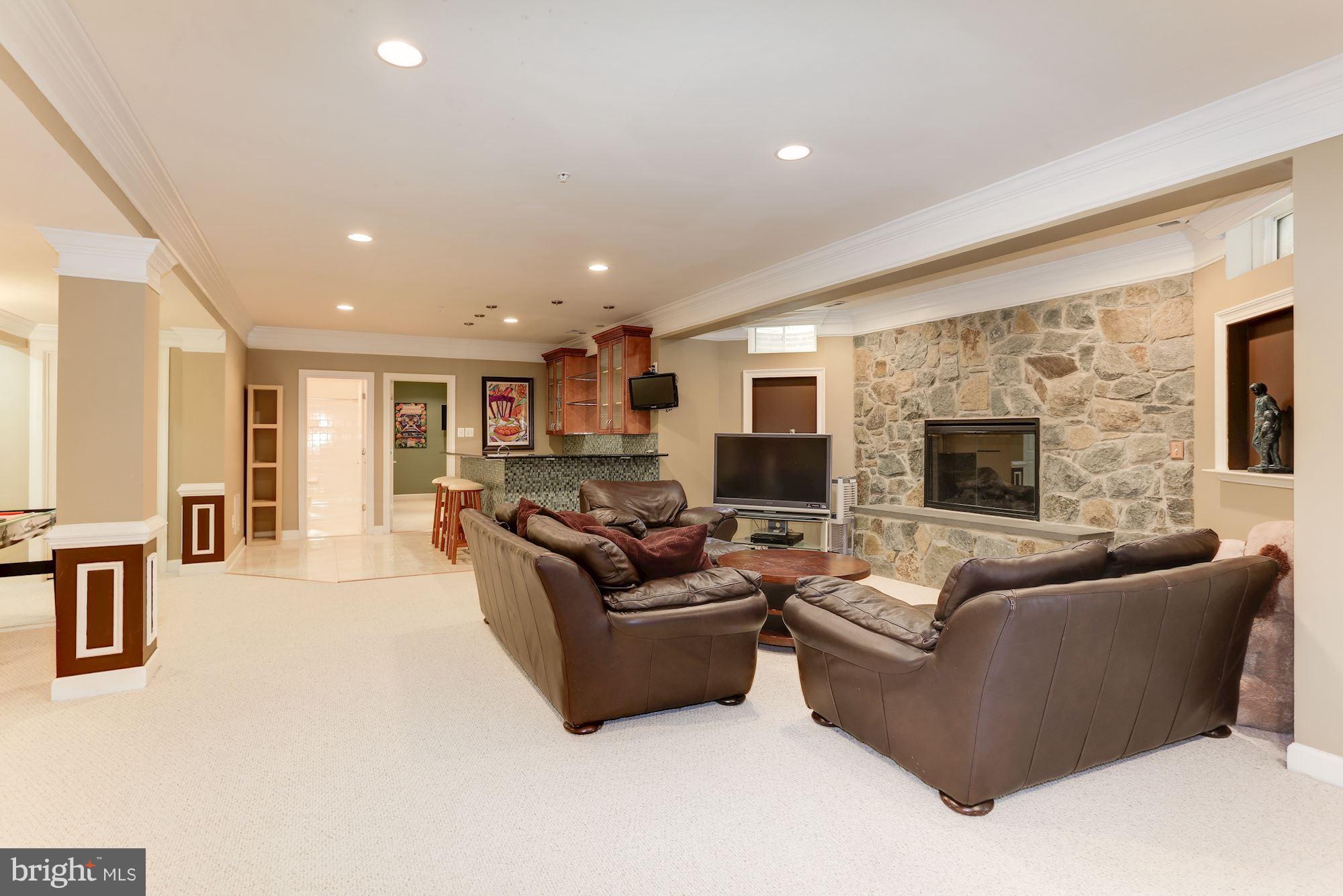 9204 Jones Mill Road Chevy Chase, MD 20815 - Photo 34 of 50 a living room with furniture and a fireplace