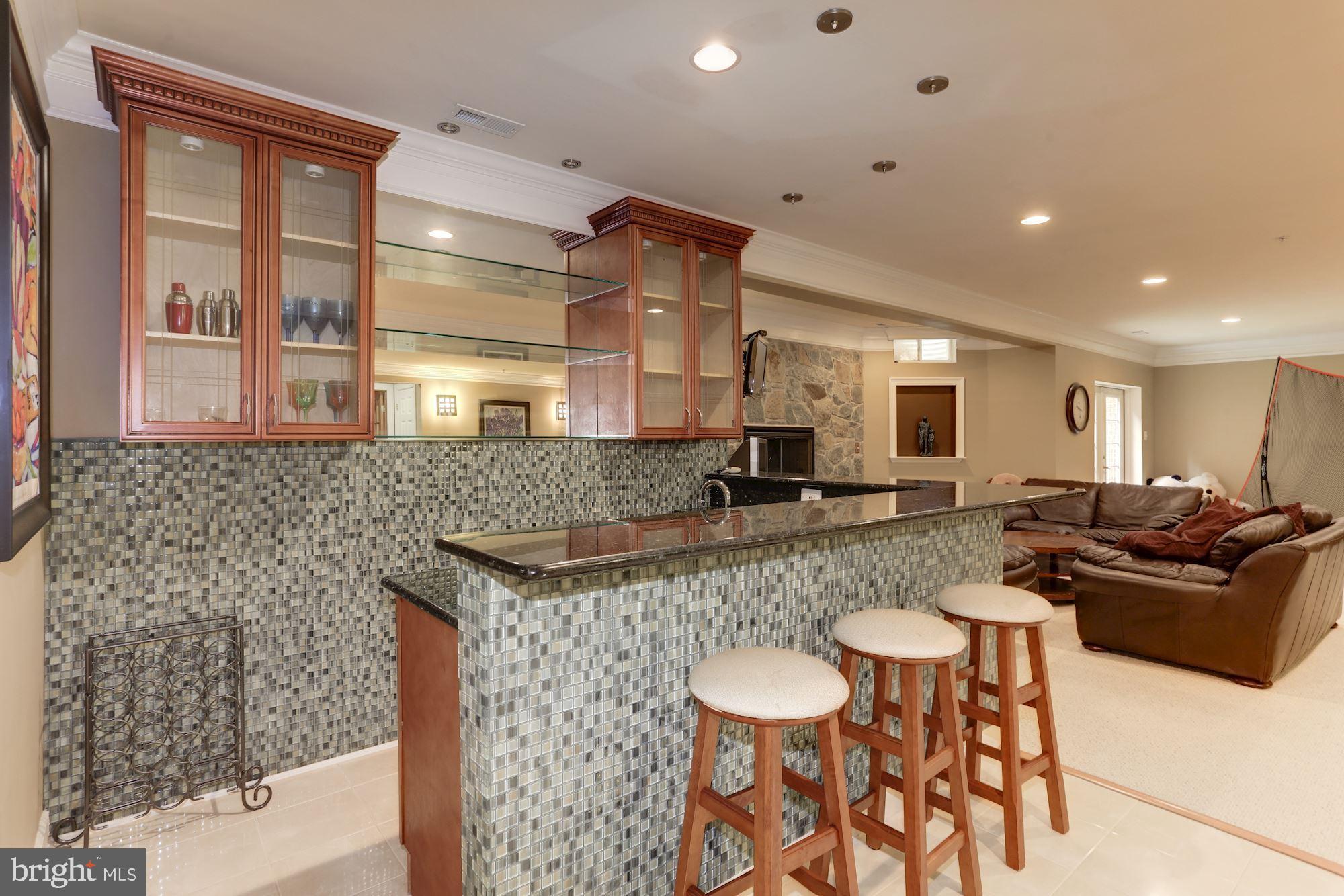 9204 Jones Mill Road Chevy Chase, MD 20815 - Photo 35 of 50 a large kitchen with a table and chairs